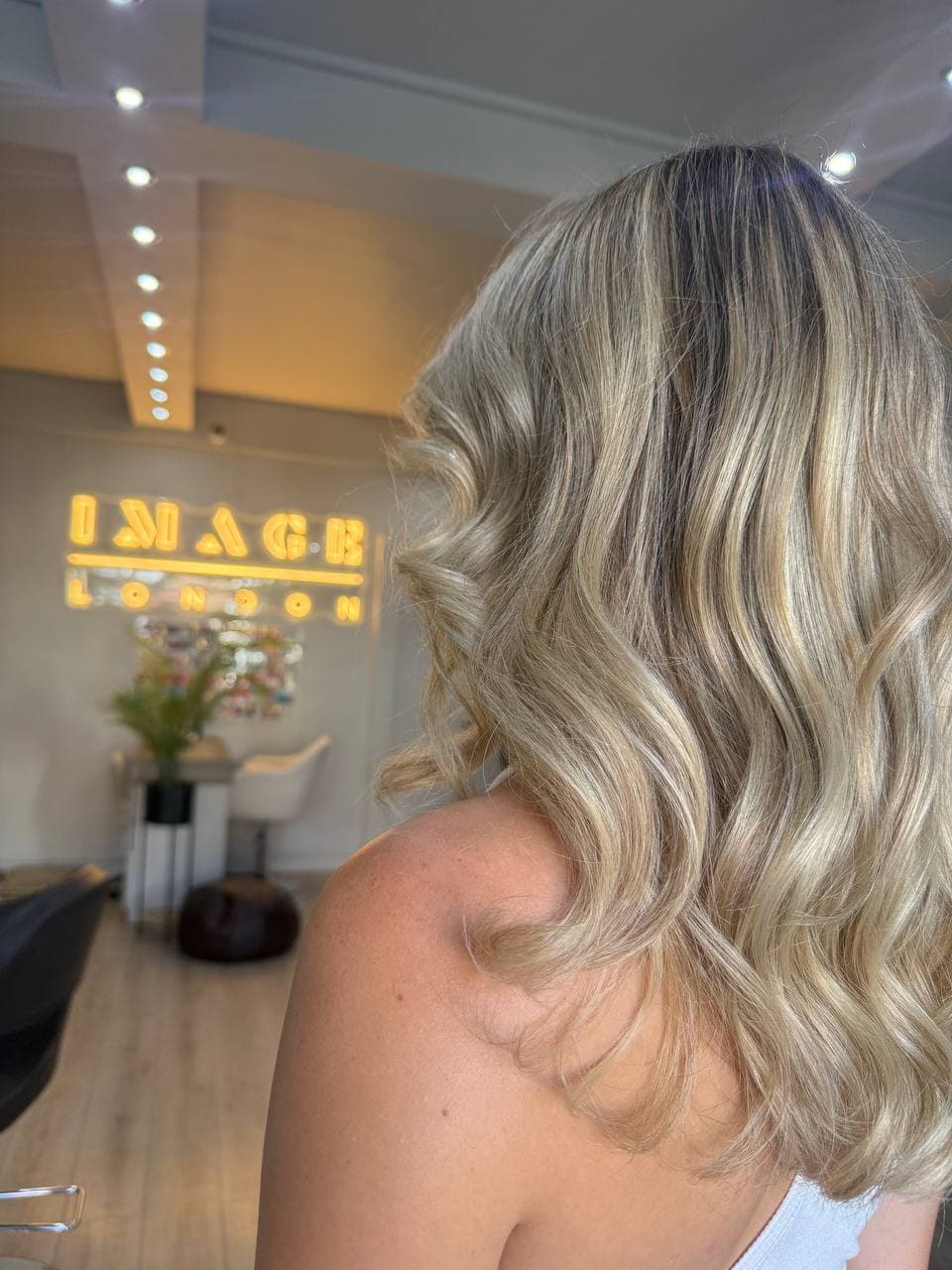 Shoulder-length blonde hair with highlights, styled at Image London