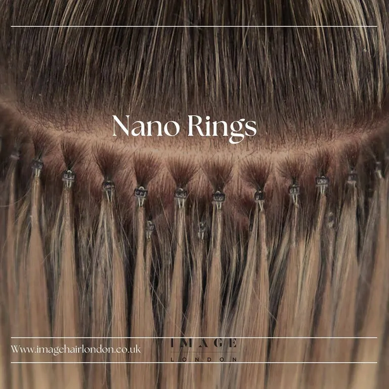 Close-up of nano ring hair extensions being fitted