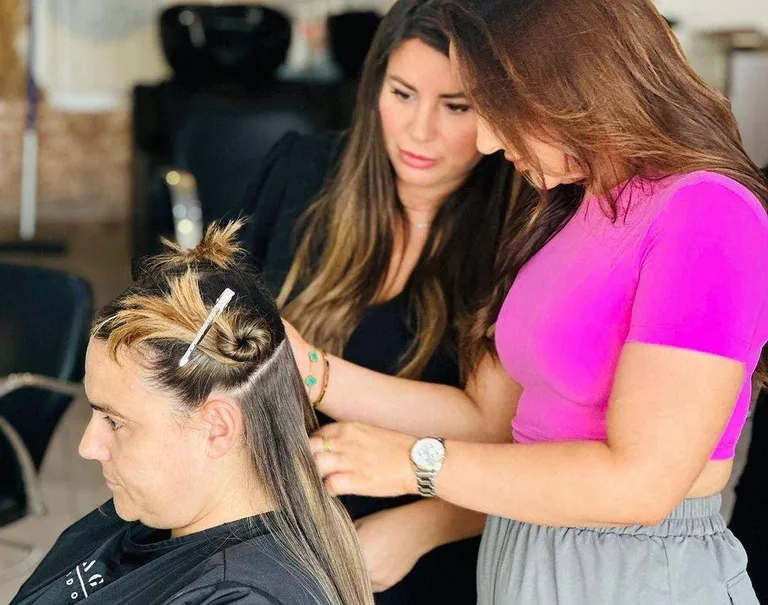 Tape-in hair extensions being applied at Image London
